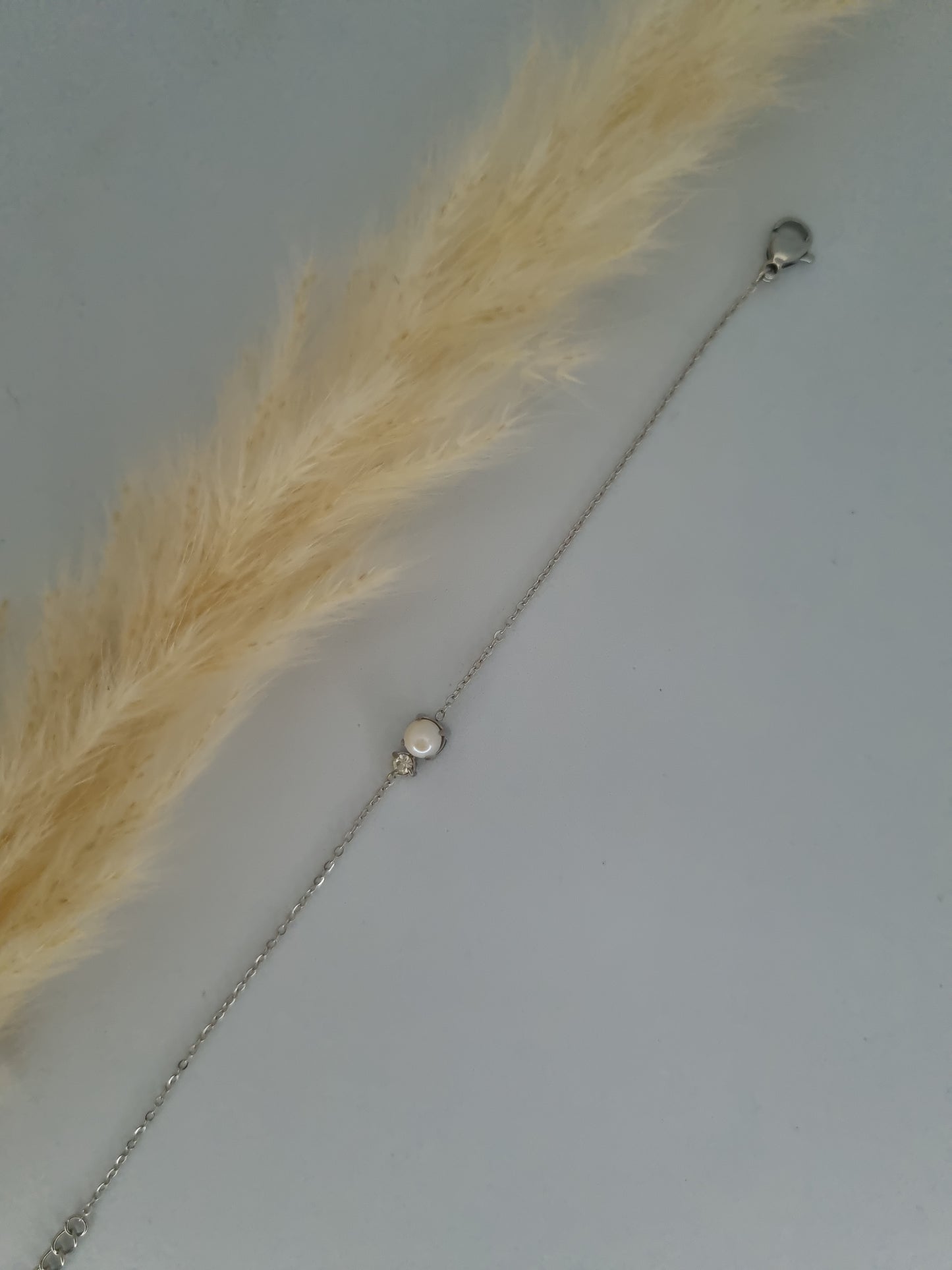 ECLAT - petite perle en résine blanche et cristal taillé
